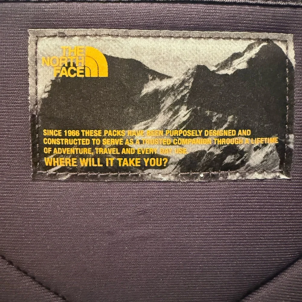 The North Face Gray and Black Backpack with Orange Logo